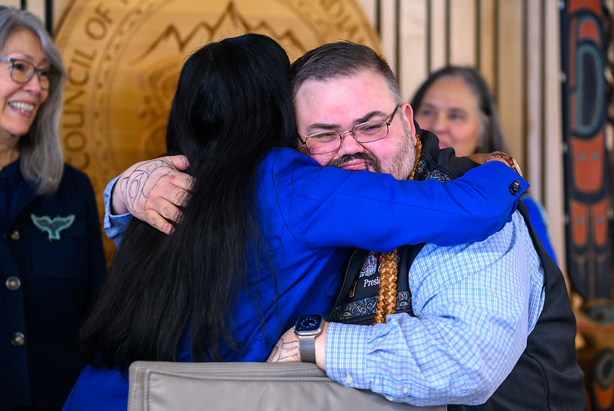 University of Alaska Southeast Chancellor Aparna Palmer embraces Chalyee Éesh Richard Peterson, president of the Central Council of the Tlingit and Haida Indian Tribes of Alaska, after signing a memorandum of understanding to formally initiate the process of developing a School of Indigenous Studies on Friday, March 27, 2026. (Jasz Garrett / Juneau Independent)